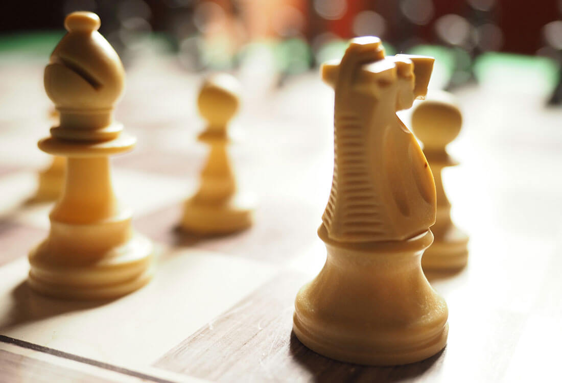 Photo of chess pieces on a board